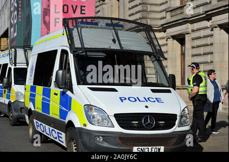 Glasgow, UK. 20 September 2019.  Scenes from a planned protest in George Square this afternoon after strikes started a year ago by 16-year-old Swedish schoolgirl named Greta Thunberg. Hundreds of chalk marked slogans littered the concrete of George Square with protestors from all ages and backgrounds. Credit: Colin Fisher/Alamy Live News Stock Photo