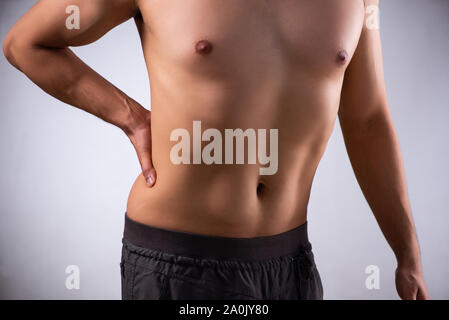 The man suffering from backbain on gray Stock Photo