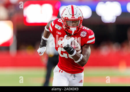 Lincoln, NE. U.S. 20th Oct, 2018. Minnesota Golden Gophers defensive  lineman Esezi Otomewo #9 reaches to tackle Nebraska Cornhuskers running  back Maurice Washington #28 in action during a NCAA Division 1 football