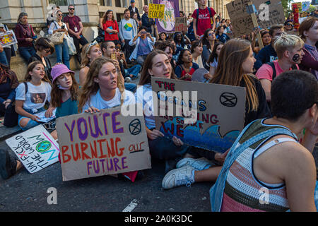 London, UK. 20th September 2019. Thousands including many schoolchildren along with teachers, parents an other older supporters came to Westminster for a rally as part of the Global Climate Strike. After the rally a large group of students marched up Whitehall before turning down Horseguards Avenue and were stopped by a line of police at the end of Whitehall Place, where they sat down. Police warned them they would be arrested unless they got up, and after some minutes they returned to Whitehall. Peter Marshall/Ģ����ý Live News Stock Photo