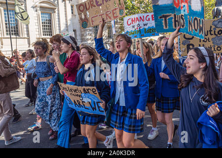 London, UK. 20th September 2019. Thousands including many schoolchildren along with teachers, parents an other older supporters came to Westminster for a rally as part of the Global Climate Strike. After the rally a large group of students marched up Whitehall before turning down Horseguards Avenue and were stopped by a line of police at the end of Whitehall Place, where they sat down. Police warned them they would be arrested unless they got up, and after some minutes they returned to Whitehall. Peter Marshall/Ģ����ý Live News Stock Photo