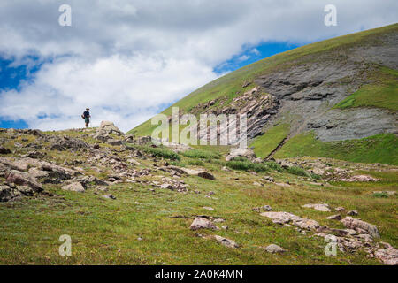 Lone hiker on a ridge above tree line in the San Juan Mountains, Weminuche Wilderness, Rocky Mountains, Colorado, USA Stock Photo