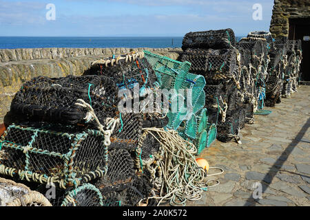 Lobster pots on the harbour wall at Lynmouth Stock Photo
