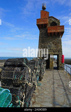 Lobster pots on the harbour wall at Lynmouth Stock Photo