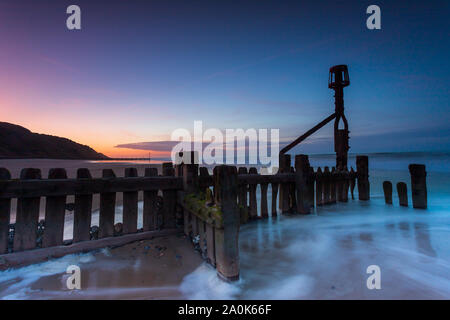 Smooth water effect on a Sea Groyne on Mundesley beach in North Norfolk in the UK Stock Photo