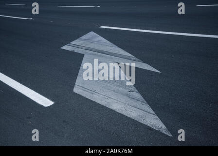 Road sign on asphalt indicating the way to the right side Stock Photo
