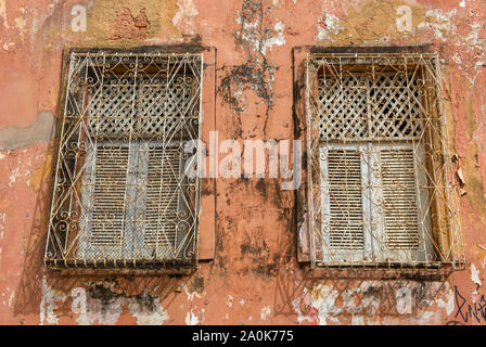 Windows of abandoned colonial house in Sao Luis historic center Stock Photo