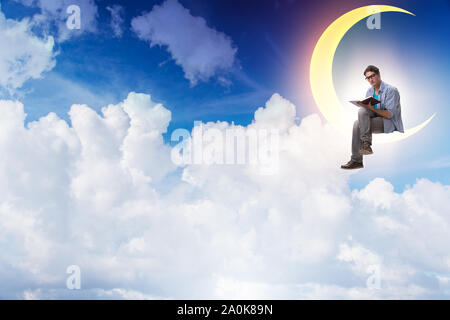 The student reading book on the moon crescent Stock Photo
