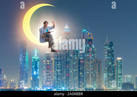 The student reading book on the moon crescent Stock Photo