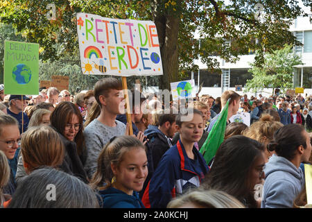 Young Demonstrants with protest signs gathering during Global Climate Strike  in Heidelberg, Germany Stock Photo