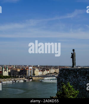 Virgin Mary Statue on walls of Buda Castle overlooking Budapest city. Stock Photo