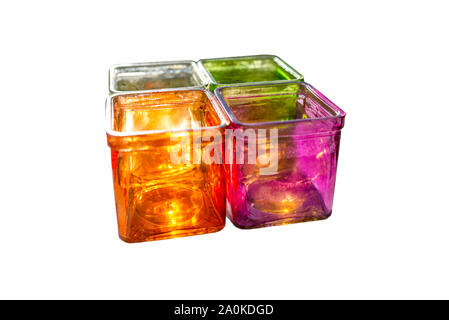 Colored glass coasters for tealights, side view, isolated on a white background with a clipping path. Stock Photo