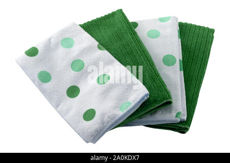 Set of microfiber dust cloths in green and white with polka dots. Cloths are on a white background. They are cleaning aids. Stock Photo