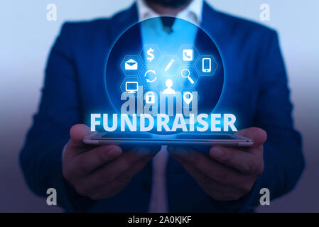 Text sign showing Fundraiser. Business photo showcasing demonstrating whose job or task is seek financial support for charity Stock Photo