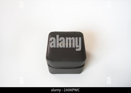 Alicante, Spain -September, 2019: Brown imitation leather jewelry travel Gucci box close up on white background Stock Photo