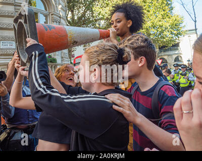 London, UK. 20th September 2019. Thousands including many schoolchildren along with teachers, parents an other older supporters came to Westminster for a rally as part of the Global Climate Strike. After the rally a large group of students marched up Whitehall before turning down Horseguards Avenue and were stopped by a line of police at the end of Whitehall Place, where they sat down. Police warned them they would be arrested unless they got up, and after some minutes they returned to Whitehall. Peter Marshall/Ģ����ý Live News Stock Photo