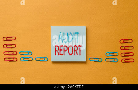 Word writing text Audit Report. Business photo showcasing An appraisal of complete financial status of a business Assets Colored blank sticky note cli Stock Photo