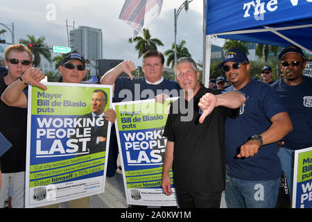 MIAMI, FLORIDA - JUNE 26: Protests outside prior to the first 2020 Democratic presidential debate including New York police officers that are protesting New York Mayor Bill de Blasio. A field of 20 Democratic presidential candidates was split into two groups of 10 for the first debate of the 2020 election, taking place over two nights at Knight Concert Hall of the Adrienne Arsht Center for the Performing Arts of Miami-Dade County on June 26, 2019 in Miami, Florida   People:  Atmosphere Stock Photo