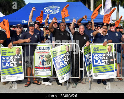 MIAMI, FLORIDA - JUNE 26: Protests outside prior to the first 2020 Democratic presidential debate including New York police officers that are protesting New York Mayor Bill de Blasio. A field of 20 Democratic presidential candidates was split into two groups of 10 for the first debate of the 2020 election, taking place over two nights at Knight Concert Hall of the Adrienne Arsht Center for the Performing Arts of Miami-Dade County on June 26, 2019 in Miami, Florida   People:  Atmosphere Stock Photo