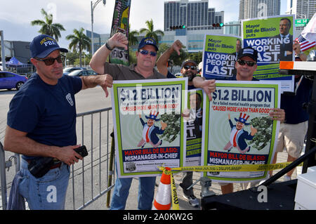 MIAMI, FLORIDA - JUNE 26: Protests outside prior to the first 2020 Democratic presidential debate including New York police officers that are protesting New York Mayor Bill de Blasio. A field of 20 Democratic presidential candidates was split into two groups of 10 for the first debate of the 2020 election, taking place over two nights at Knight Concert Hall of the Adrienne Arsht Center for the Performing Arts of Miami-Dade County on June 26, 2019 in Miami, Florida   People:  Atmosphere Stock Photo