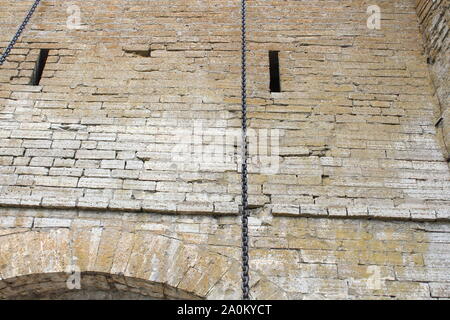 Destroyed by time and precipitation brick wall. The Background of old vintage brick wall Stock Photo