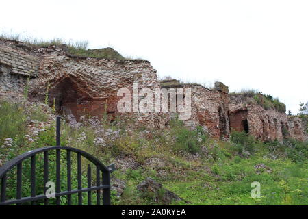 Destroyed by time and precipitation brick wall. The Background of old vintage brick wall Stock Photo
