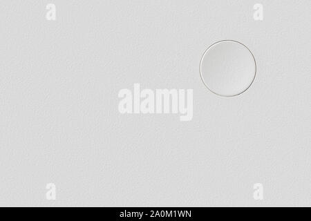 White plastic surface with single blank button and copy space. Template and background Stock Photo