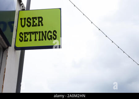 Word writing text User Settings. Business photo showcasing Configuration of appearance Operating System Personalized Green ad board on the street with Stock Photo