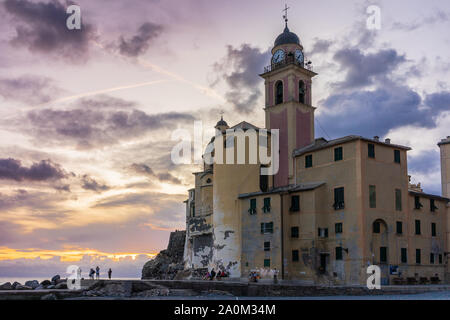 Church of Santa Maria Assunta (Basilica Di Santa Maria Assunta) along Camogli Beach during sunset, Camogli, Liguria, Italy Stock Photo