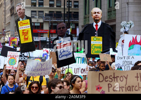 New York, NY. September 20, 2019. Protesters carry effigies of energy company CEOs at the youth-led NYC Climate Strike. Tens of thousands of people, students attended the march and rally down Broadway to Battery Park with Greta Thunberg as a participant and featured guest. Stock Photo