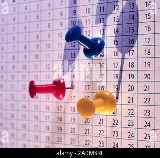 Close up of push pins stuck on some paper Stock Photo