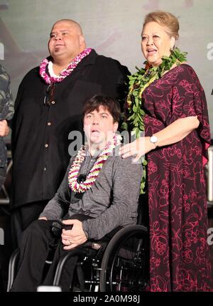 September 19, 2019 - Looking like a family portrait, Shawn Mokuahi, Christopher Thornton and Amy Hill during the Hawaii Five-O and Magnum P.I. Sunset On The Beach event on Waikiki Beach in Honolulu, Hawaii - Michael Sullivan/CSM Stock Photo