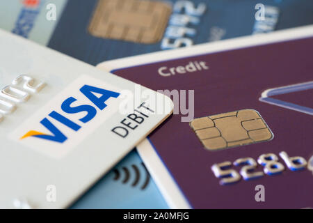 Debit Visa and Mastercard credit cards showing the concepts of finances and debt Stock Photo