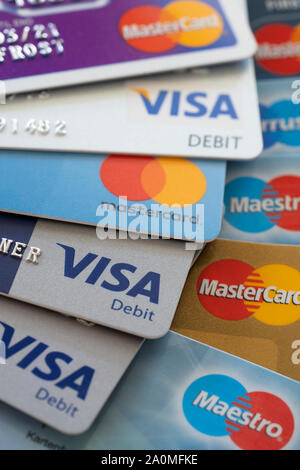 Debit Visa and Mastercard credit cards showing the concepts of finances and debt Stock Photo