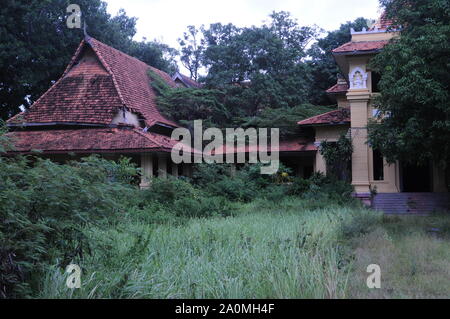 The now defunct & overgrown Hotel Renakse near The Royal Palace, Phnom Penh, Cambodia. credit: Kraig Lieb Stock Photo