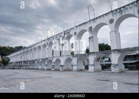 Rio de Janeiro, Brazil - August 18 2013: Arches of Lapa and city in downtown. Stock Photo