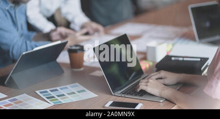 Cropped shot of young passionate UX web designer plaining their interface project together with laptop computer Stock Photo