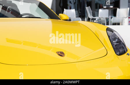 Vallelunga, Italy september 14 2019. Porsche Carrera sport car yellow front view logo on hood and light Stock Photo