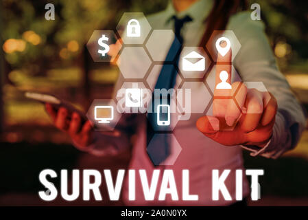 Handwriting text writing Survival Kit. Conceptual photo Emergency Equipment Collection of items to help someone Stock Photo