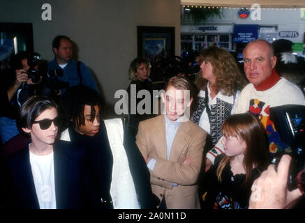 Westwood, California, USA 17th December 1994 (L-R) Actor Michael Maccarone, actor Joel Robinson, actor Macaulay Culkin, actress Stephi Lineburg and publicist Paul Bloch attend Warner Bros. Pictures' 'Richie Rich' Premiere on December 17, 1994 at Mann Bruin Theatre in Westwood, California, USA. Photo by Barry King/Alamy Stock Photo Stock Photo