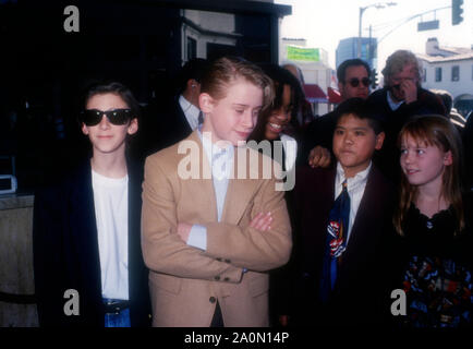 Westwood, California, USA 17th December 1994 (L-R) Actor Michael Maccarone, actor Macaulay Culkin, actor Joel Robinson, actor Jonathan Hilario and actress Stephi Lineburg attend Warner Bros. Pictures' 'Richie Rich' Premiere on December 17, 1994 at Mann Bruin Theatre in Westwood, California, USA. Photo by Barry King/Alamy Stock Photo Stock Photo