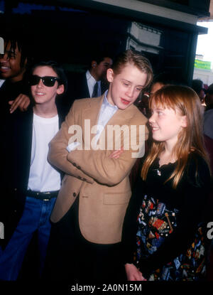 Westwood, California, USA 17th December 1994 (L-R) Actor Joel Robinson, actor Michael Maccarone, actor Macaulay Culkin and actress Stephi Lineburg attend Warner Bros. Pictures' 'Richie Rich' Premiere on December 17, 1994 at Mann Bruin Theatre in Westwood, California, USA. Photo by Barry King/Alamy Stock Photo Stock Photo