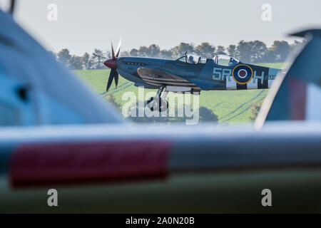 Duxford, UK. 21st Sep 2019. A two seater Spitfire takes off for a practice flight - Duxford Battle of Britain Air Show at the Imperial War Museum. Also commemorating the 50th anniversary of the 1969 Battle of Britain film. It runs on Saturday 21 & Sunday 22 September 2019 Credit: Guy Bell/Alamy Live News Stock Photo