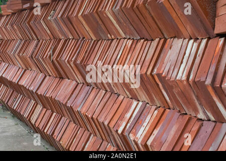 Square burnt clay tiles piled together. This is used on house and temple construction in the South East Asian countries. Stock Photo