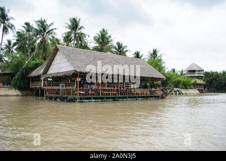 JULY 18, 2019-MEKONG DELTA, VIETNAM : FLoating restaurant along the Mekong Delta river in Vietnam. Stock Photo