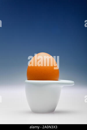 Egg in a white egg cup Stock Photo