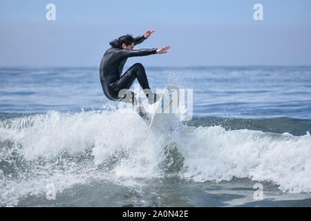 California surfer doing a trick maneuver off the coast of Dillon Beach. Stock Photo