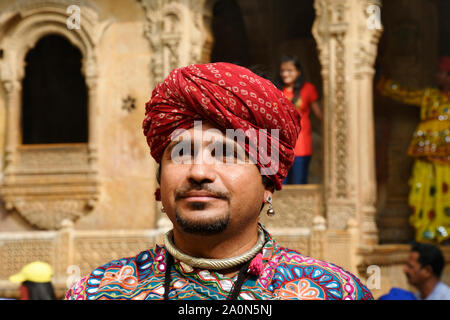 JAISALMER, RAJASTHAN, INDIA, November 2018, Tourist in traditional Rajasthani turban and costume near Kothari's Patwon ki Haveli Stock Photo