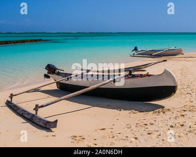 Traditional outrigger pirogue moored on white sand beach, Nosy Ve island, Indian Ocean, Madagascar Stock Photo