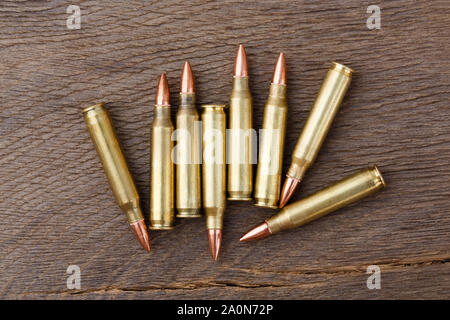 Bullets on rustic wooden background close up. Stock Photo